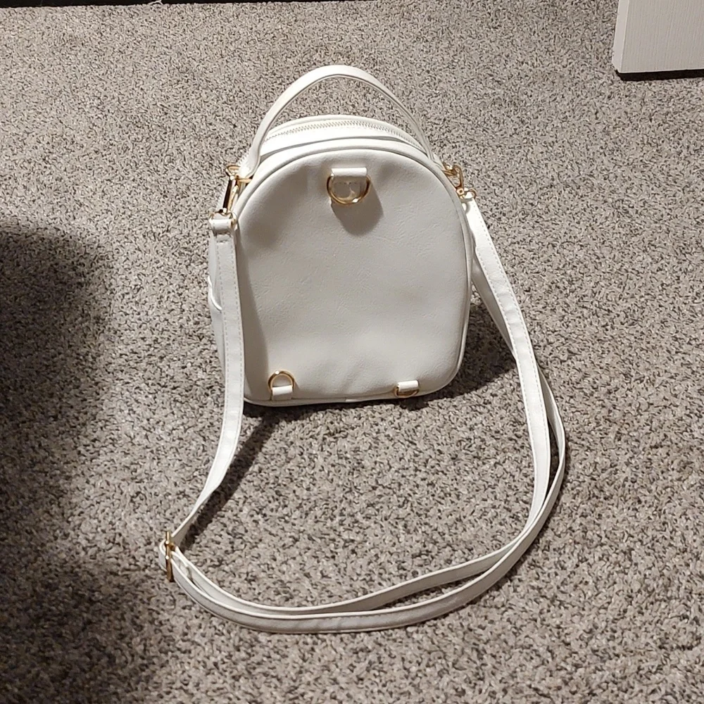 Girls white backpack with Pom
